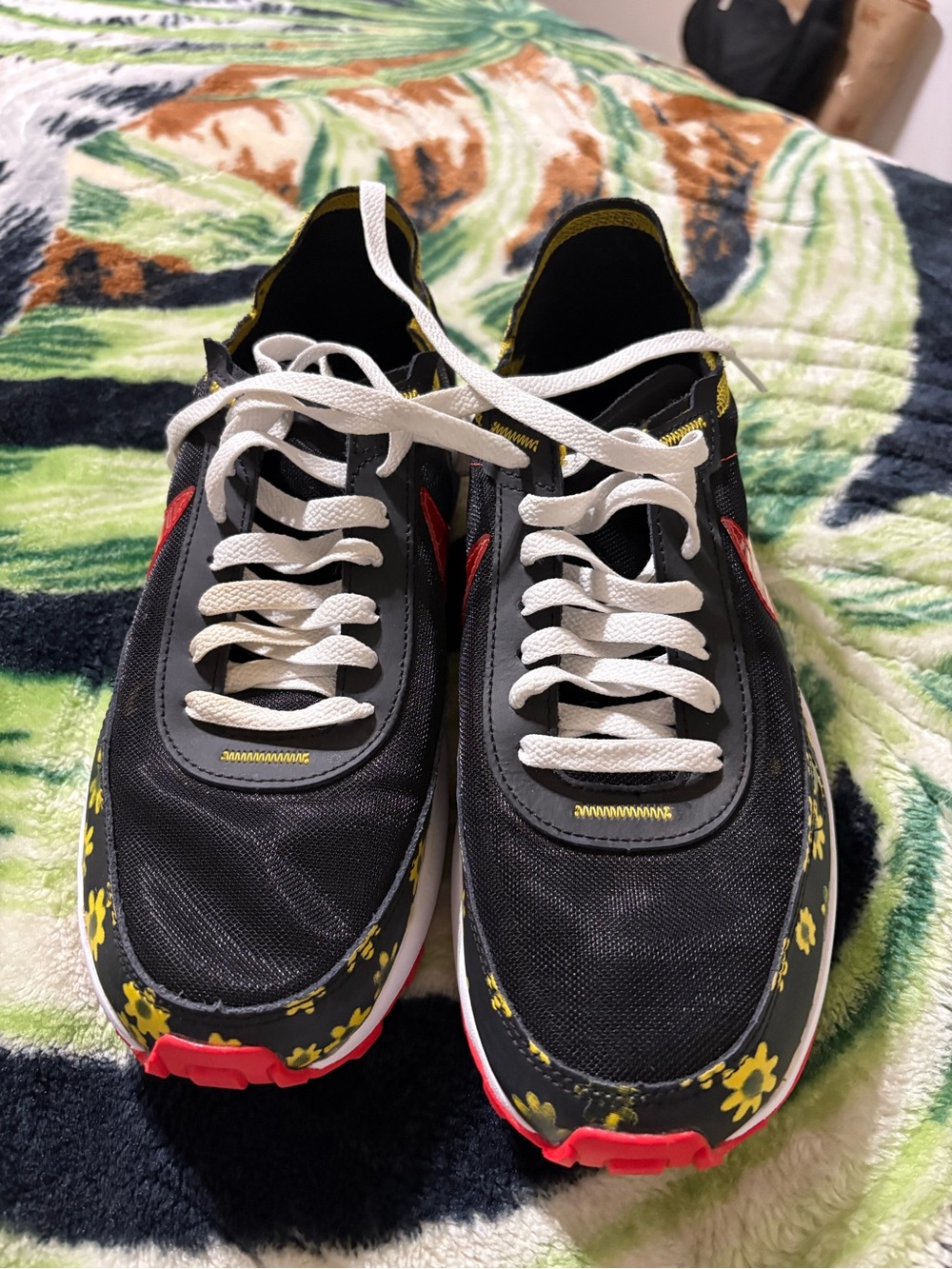 Nike Black Sneakers with Yellow Floral Accents and Red Details